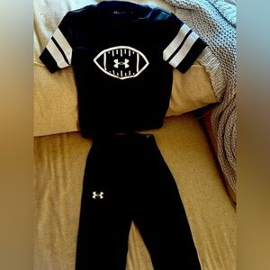 Boys black under Armor football shirt and pants. Size can pants and size 5 shirt